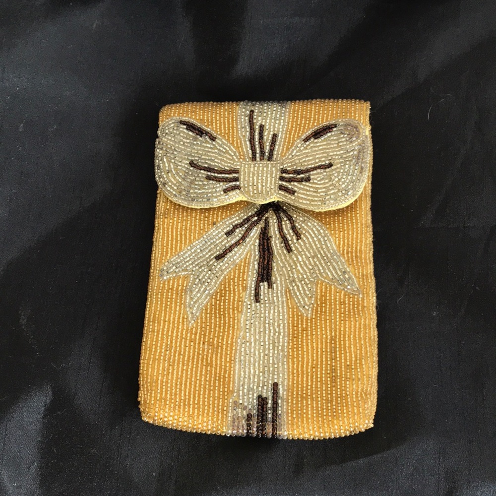 Neiman Marcus gold beaded phone case
